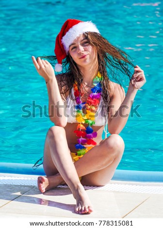 Similar – Image, Stock Photo woman in a Santa hat with lighted sparklers on the background of a New Year or Christmas tree decorated with red ball.