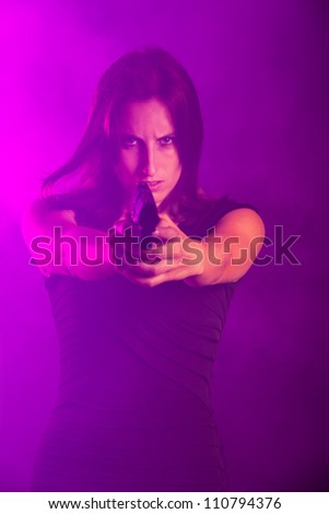 woman with a gun in the fog