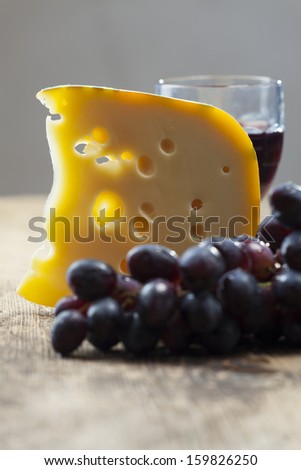 swiss cheese, grapes and red wine