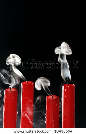 smoke from four blown out candles