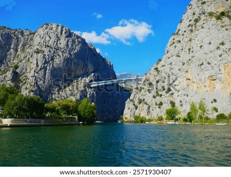 Similar – Image, Stock Photo Old ancient bridge above small river in mountain valley