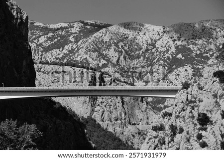 Similar – Image, Stock Photo Old ancient bridge above small river in mountain valley