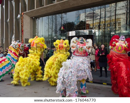 lion dance, take part in the celebration of Chinese New Year on Feb 1, 2014 in Wuhan, China. Various traditional performance attract many people to the street