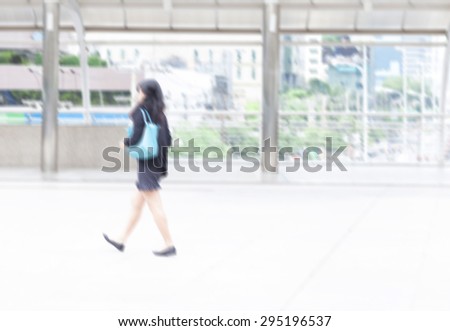 motion blur woman office worker walking to work