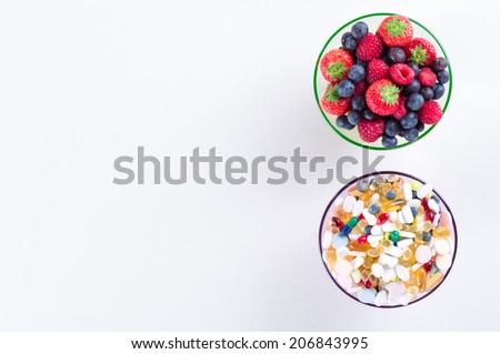 Healthy lifestyle, diet concept, Fruit and pills, vitamin supplements with copy space on white background