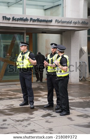 EDINBURGH, SCOTLAND, UK - September 18, 2014 - police men guarding scottish parlament building on independence referendum day