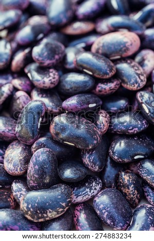 Purple beans on white background close up