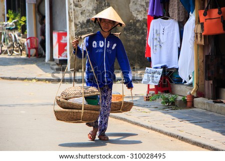 HOI AN, VIETNAM - APIRL 14: An unidentified man on Apirl 14, 2014 in Hoi An, Vietnam. Hoi An, a UNESCO World Heritage site, is a major touristic destination in Central Vietnam.
