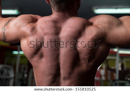 Bodybuilder Doing Exercise For Back