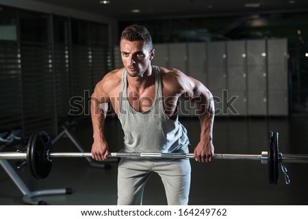 Bent Over Row Exercise For Back. Man Doing Heavy Weight Exercise For Back