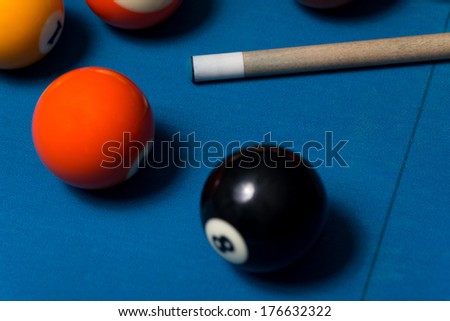 Pool Table With Balls And Cue Stick - Close-Up Of Pool Balls On A Blue Pool Table