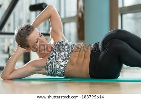Work Those Abs - Attractive Female Athlete Performing Exercise For Abdominal Muscles
