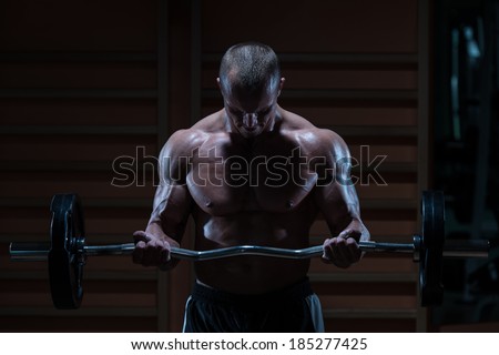 Challenge Yourself - Muscular Man Doing Heavy Weight Exercise For Biceps