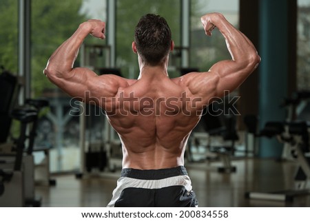 Body Builder Performing Rear Double Biceps Pose