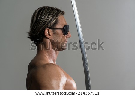 Strong Man With Samurai Sword - Portrait Of A Handsome Muscular Ancient Warrior With A Sword