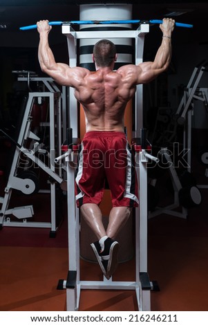 Male Bodybuilder Doing Heavy Weight Exercise For Back