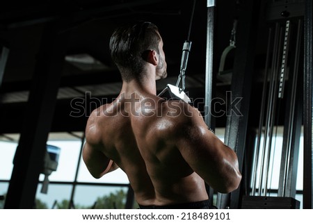 Young Bodybuilder Doing Heavy Weight Exercise For Back In Gym