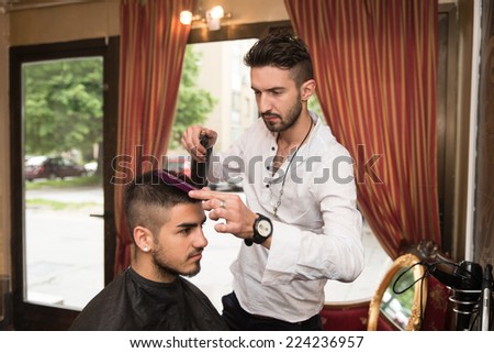 Male Hairstylist Water Sprayer On Hair On Hair - Handsome Young Hairdresser Giving A New Haircut To Male Customer At Parlor