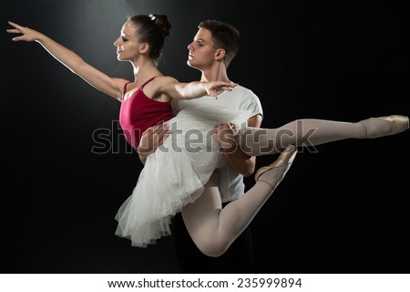 Handsome Couple Ballet Dancer On A Black Background
