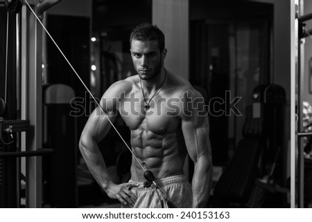 Young Athlete Doing Heavy Weight Exercise For Triceps