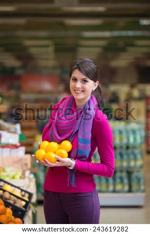 Beautiful Young Woman Shopping For Fruits And Vegetables In Produce Department Of A Grocery Store - Supermarket - Shallow Deep Of Field