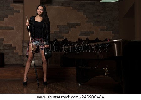 Portrait Of A Young Woman Playing Billiards