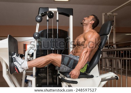 Bodybuilder Doing Heavy Weight Exercise For Legs