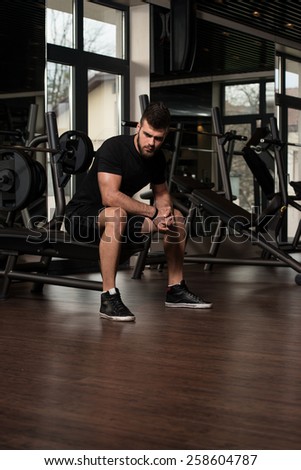 Portrait Of A Physically Fit Young Man Resting In A Health Modern Club