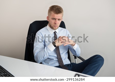 Young Business Man With Problems And Stress In The Office