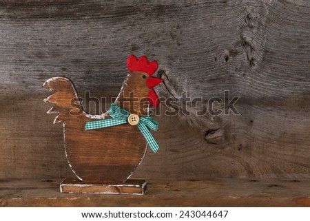 Funny welcome chicken rooster hen country cottage kitchen wood shape sign decoration toy on old rough background with copy space