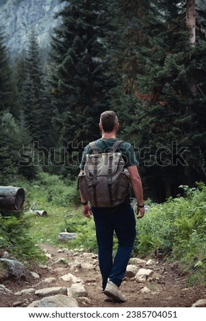 Similar – Image, Stock Photo Male hiker with backpack in highland valley