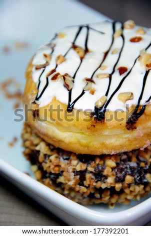 Donut topping with white sugar, almond and chocolate almond donut.