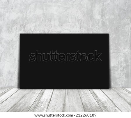 Blank black paper poster and light gray cement wall, background, template