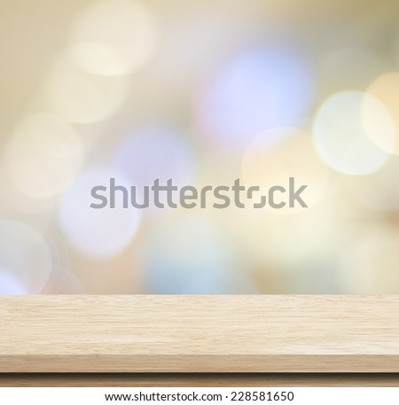 Empty wooden deck table over blur festive bokeh background, for product montage