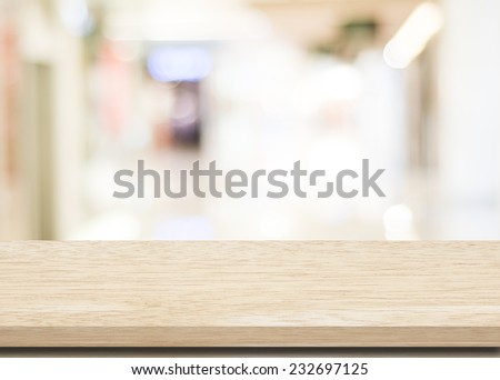 Empty table and blurred store with bokeh background, product display template.