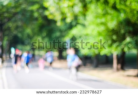 Blurred background of people activities in park with bokeh