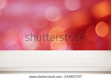 Empty white wooden table over blur festive bokeh background, for product montage