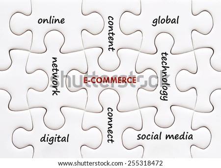 Related E-commerce words on jigsaw puzzle background, success in business concept