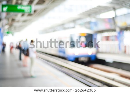 Blurred people waiting for subway at station, transportation background