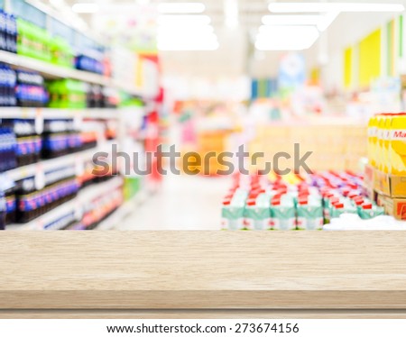 Empty table over blur supermarket background, product display, template, business concept