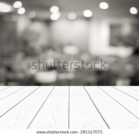 Perspective wood over blurred restaurant with bokeh background, foods and drinks, product display montage, black and white tone