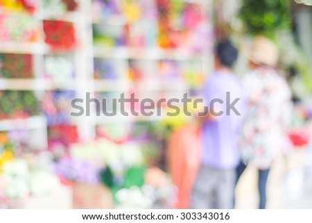 Blurred people shopping at street fair market , blur background, summer flea market