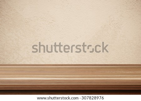 Empty wooden table over brown cement wall, vintage, background, template, product display