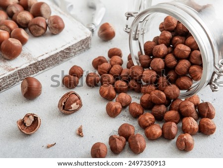 Image, Stock Photo whole organic hazelnuts. Top view autumn texture background. Harvest, autumn. Food ingredient hazelnuts background, detailed close up.