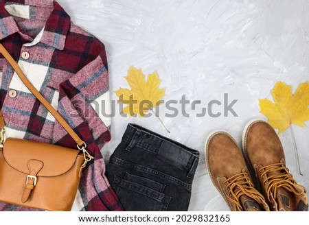 Similar – Image, Stock Photo Women fashion composition. Warm winter female woollen knitted sweaters, pullovers stack on a wooden stool at white background. Modern clothes concept for magazine, blog, social media.