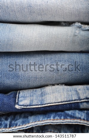stack of folded jeans close up