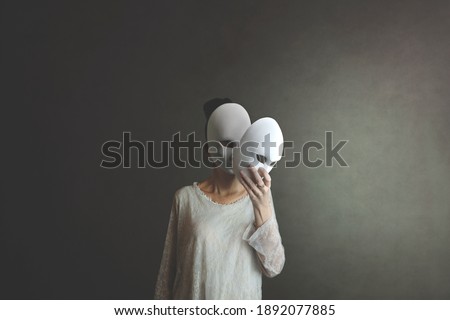 woman takes off the mask from her face but underneath her she has another mask, concept of hiding one's soul and oneself