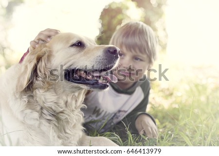 Similar – Image, Stock Photo Child kindly caresses his dog