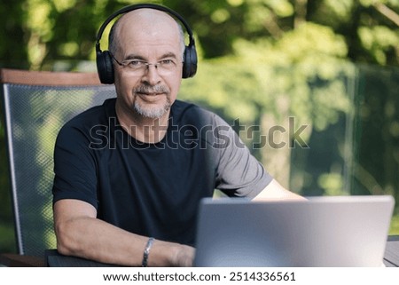 Similar – Image, Stock Photo Handsome male freelancer using laptop in living room