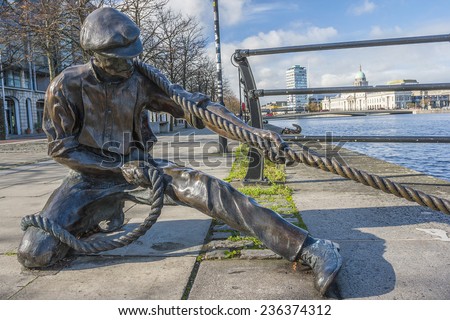 Dublin, Ireland - Oct 25, 2014: The Linesman statue at Liffey river in Dublin, Ireland on October 25, 2014